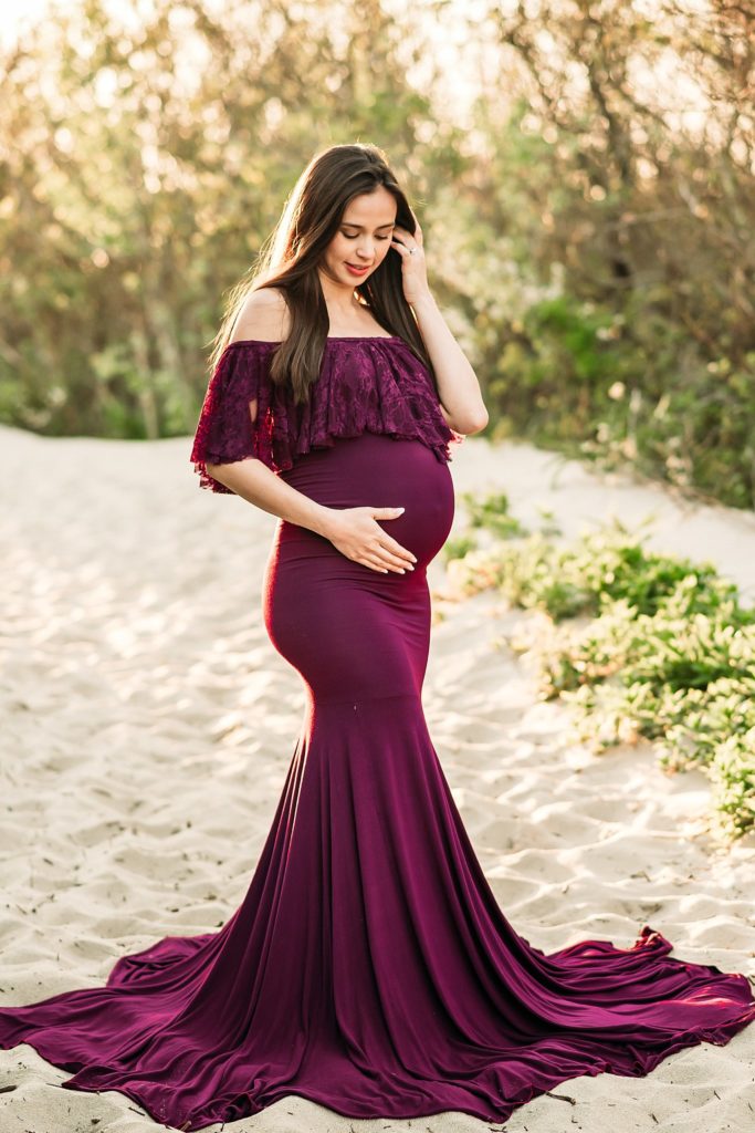 maroon maternity dress on the beach